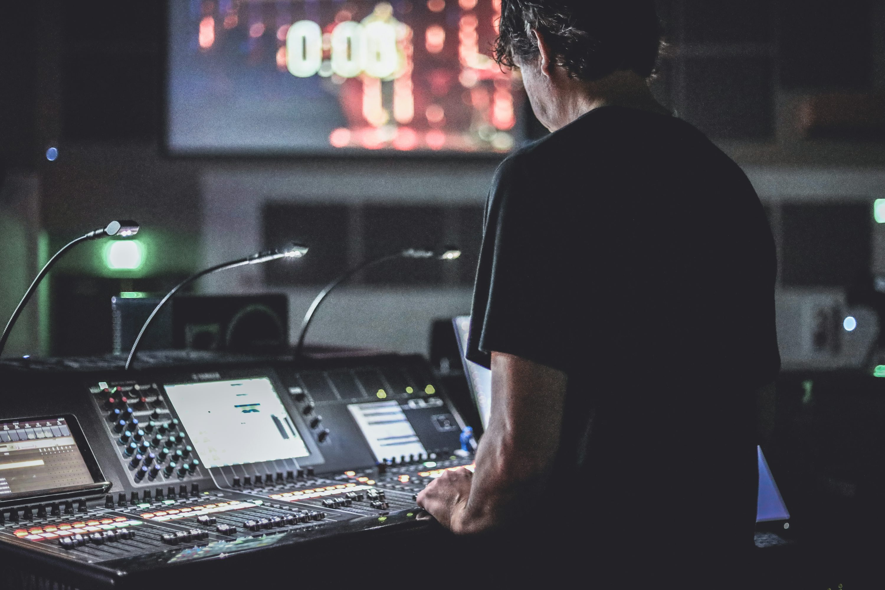 Show caller managing a live production from a control console